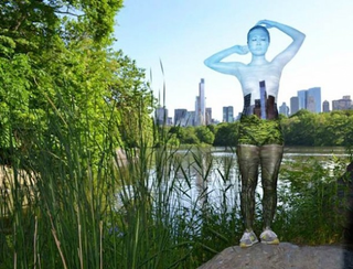 Illustration for article titled Women's bodies blend into a city's background with just bodypaint